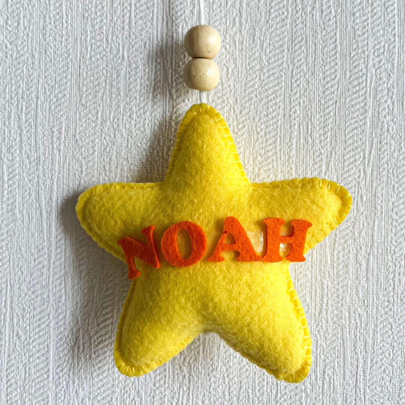 Baby Ellie on a Moon Name Hanging