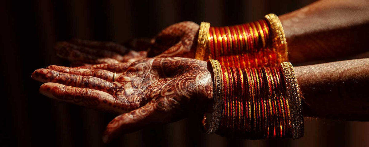 Close-up of hindu bride's hands covered with mehndi tattoos